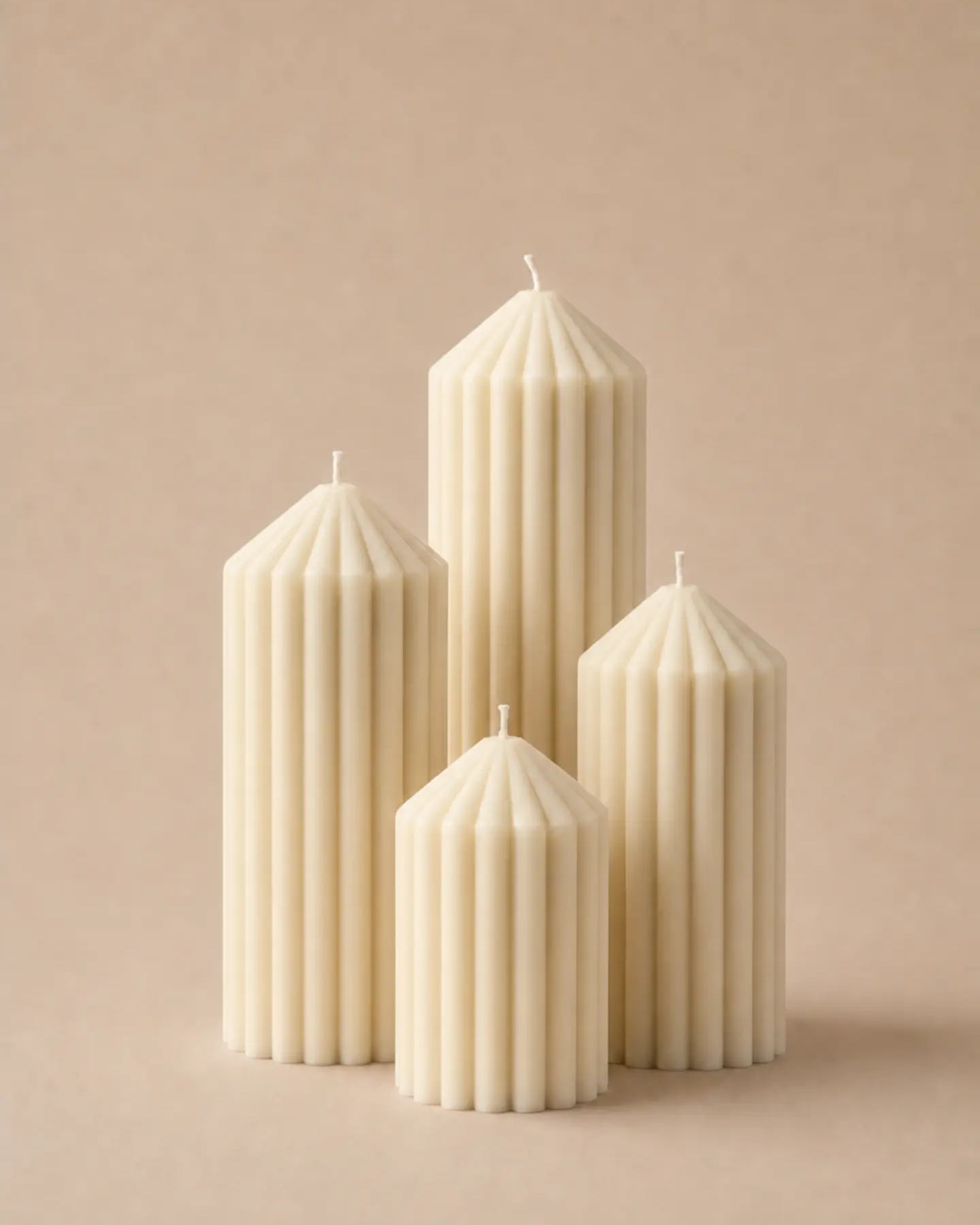 The Company fluted column candles standing together